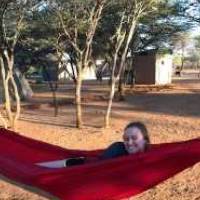 Student laying in a hammock